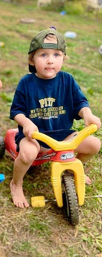 Brentley joined the competition — help win amazing prizes! bicycle_handlebar, child, cool, fun, grass, happy, headwear, human_leg, leisure, outdoor_play_equipment, people_in_nature, person, photograph, recreation, shorts, t_shirt, thigh, tire, toddler, tree