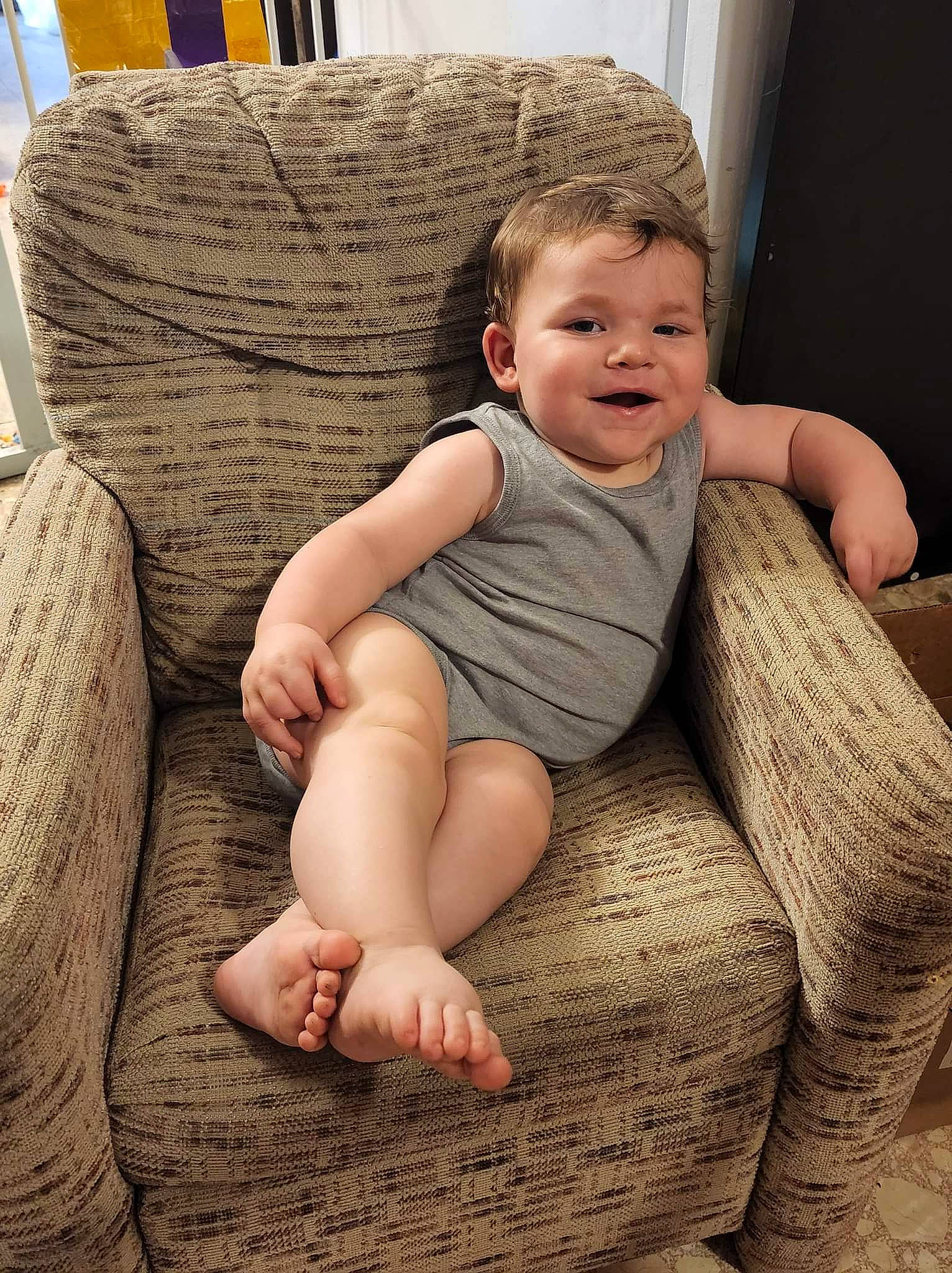 Austin is registered to the contest to win money with this photo: arm, baby, cheek, comfort, eye, face, finger, flash_photography, hand, human, leg, mammal, muscle, person, shoulder, skin, smile, stomach, thigh, vertebrate