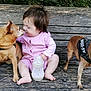 animal, baby, bench, bottle, child, cute, dog, face, friendship, fur, grass, interaction, leash, nature, outdoor, pet, pink_clothing, sitting, toddler, wood