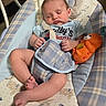 Waylon joined the competition — help win amazing prizes! baby, sleeping, infant, toy, baby_seat, blue, orange, plush_toy, clothing, strap, pattern, comfort, peaceful, indoor, child, cute, face, hands, legs, foot