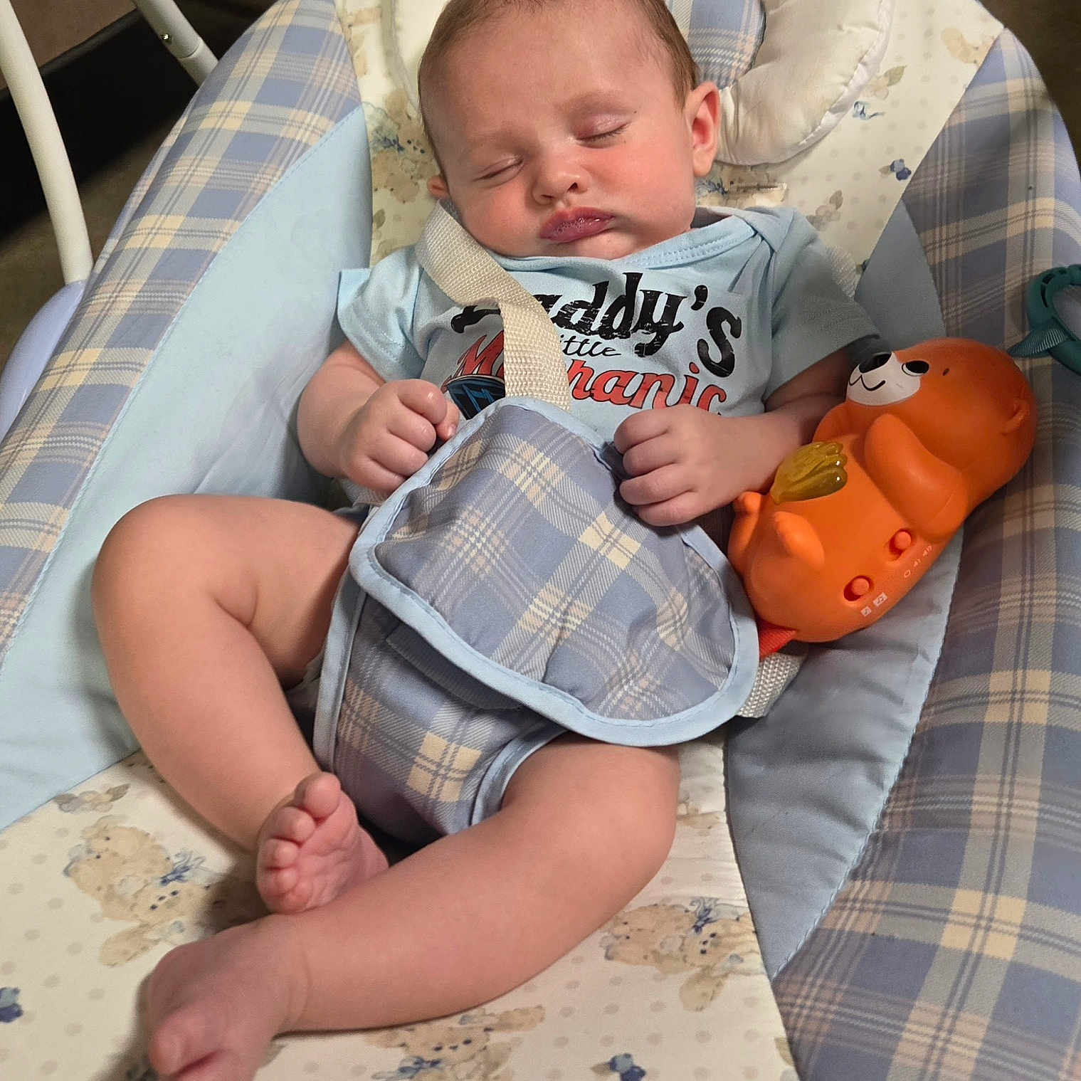 Waylon joined the competition — help win amazing prizes! baby, sleeping, infant, toy, baby_seat, blue, orange, plush_toy, clothing, strap, pattern, comfort, peaceful, indoor, child, cute, face, hands, legs, foot