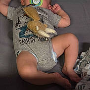 Waylon is registered to the contest to win money with this photo: baby, sleeping, pacifier, toy, onesie, diaper, playpen, mesh, padded, grey, infant, child, resting, comfortable, indoors, cute, peaceful, toddler, soft_toy, clothing
