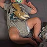 baby, sleeping, pacifier, toy, onesie, diaper, playpen, mesh, padded, grey, infant, child, resting, comfortable, indoors, cute, peaceful, toddler, soft_toy, clothing