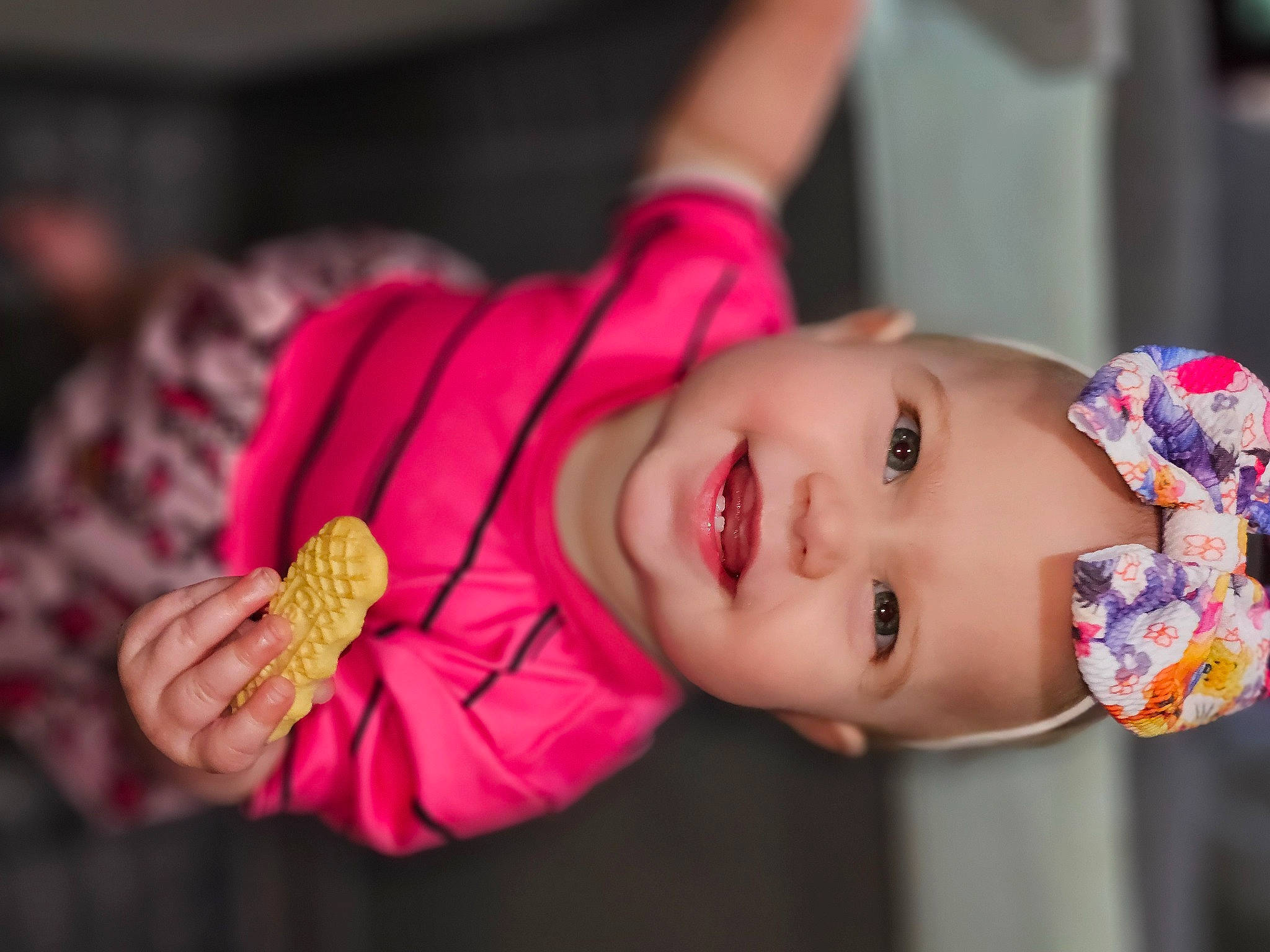 Sofia is registered to the contest to win money with this photo: baby, baby_products, baby_toddler_clothing, child, close_up, dress, eyelash, fashion_accessory, grass, happy, headwear, joy, lip, nose, person, pink, plant, skin, smile, toddler