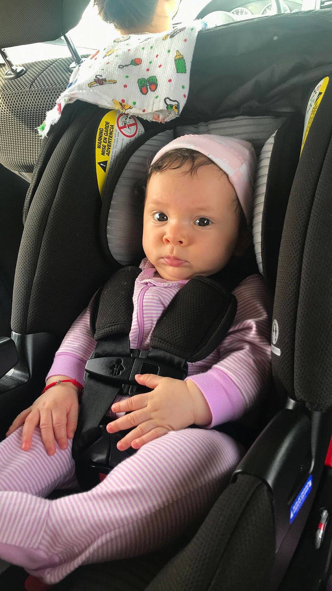 Leyla is registered to the contest to win money with this photo: auto_part, baby, baby_carriage, baby_in_car_seat, baby_products, car_seat, car_seat_cover, child, comfort, person, product, seat_belt, toddler