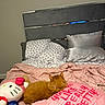 Homegirl Hazel joined the competition — help win amazing prizes! bed, bedroom, blanket, cat, cozy, cute, decor, domestic_animal, furniture, headboard, hello_kitty, message, orange_cat, pet, pillow, pink, plush_toy, sleeping, soft_lighting, text_overlay
