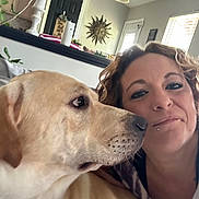 Murdaugh joined the competition — help win amazing prizes! casual, close_up, couch, curly_hair, decor, dog, face, furniture, indoor, light, lip_piercing, living_room, nose_ring, pet, plant, selfie, smile, wall_art, window, woman