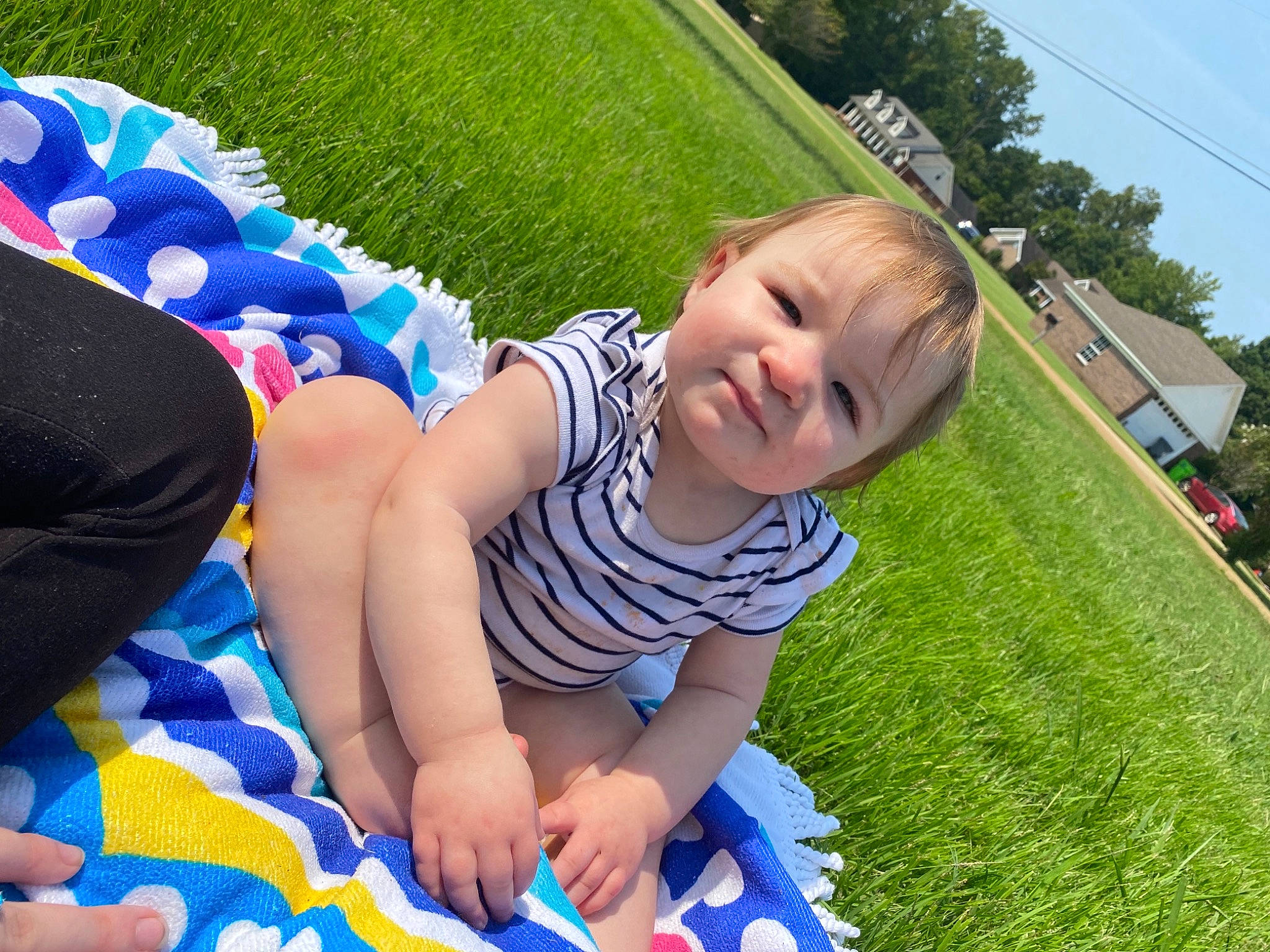 Hadleigh is registered to the contest to win money with this photo: baby, baby_toddler_clothing, blue, child, electric_blue, fun, grass, green, happy, lawn, leaf, leisure, meadow, people_in_nature, person, plant, recreation, sky, smile, toddler