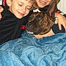 blanket, blue, child, clothing, comfort, cozy, cuddling, dog, face, family, furniture, happy, home, hugging, indoor, portrait, radiator, smiling, together, warm
