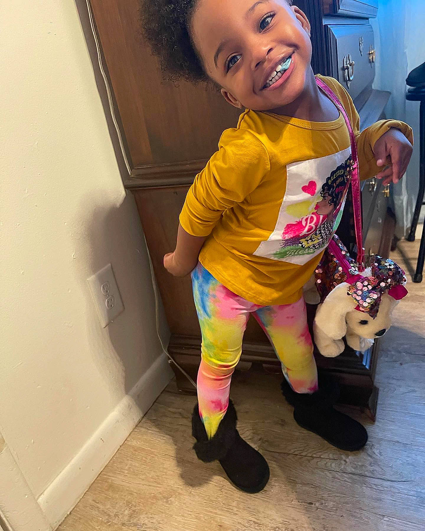 Alayna is registered to the contest to win money with this photo: baby, baby_toddler_clothing, blond, finger, flooring, fun, happy, human_leg, joy, knee, magenta, mouth, person, pink, sandal, selfie, sleeve, sneakers, sportswear, t_shirt