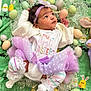 accessories, baby, balloon, bodypart, clothing, egg, face, finger, flower, food, hand, hat, head, people, person, photography, portrait, purple, sitting, sweets