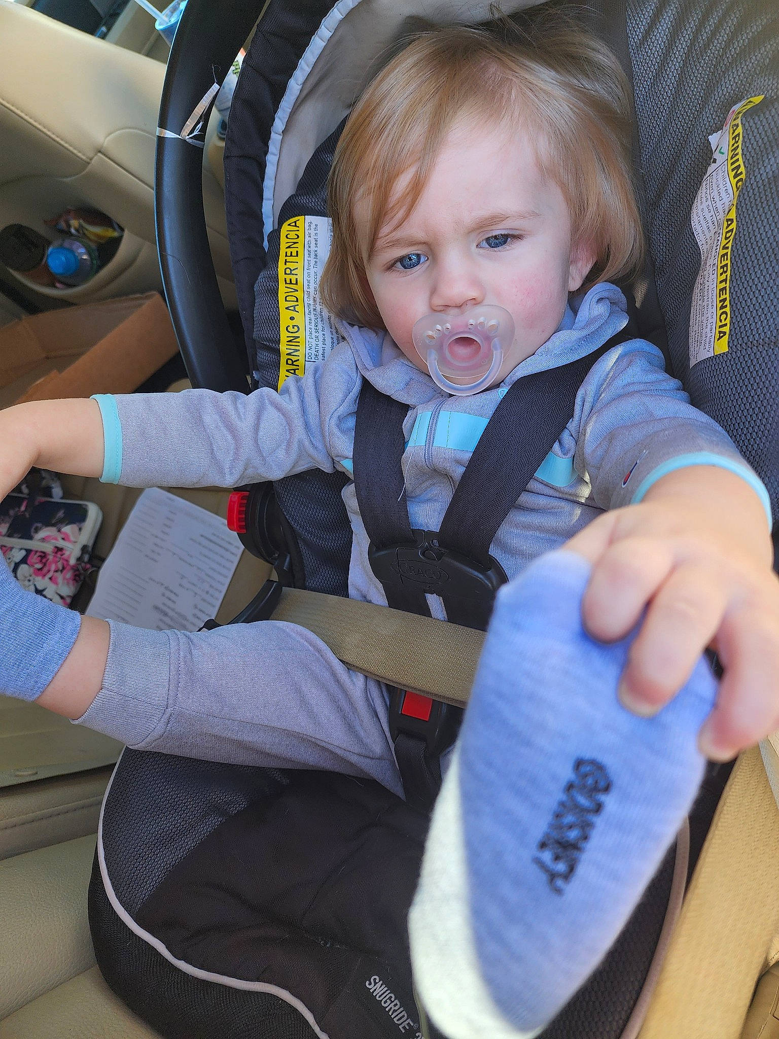 Gavin is registered to the contest to win money with this photo: auto_part, baby_carriage, baby_in_car_seat, baby_products, baby_safety, baby_toddler_clothing, car, car_seat, car_seat_cover, child, comfort, electric_blue, face, family_car, motor_vehicle, person, personal_luxury_car, sitting, steering_wheel, toddler