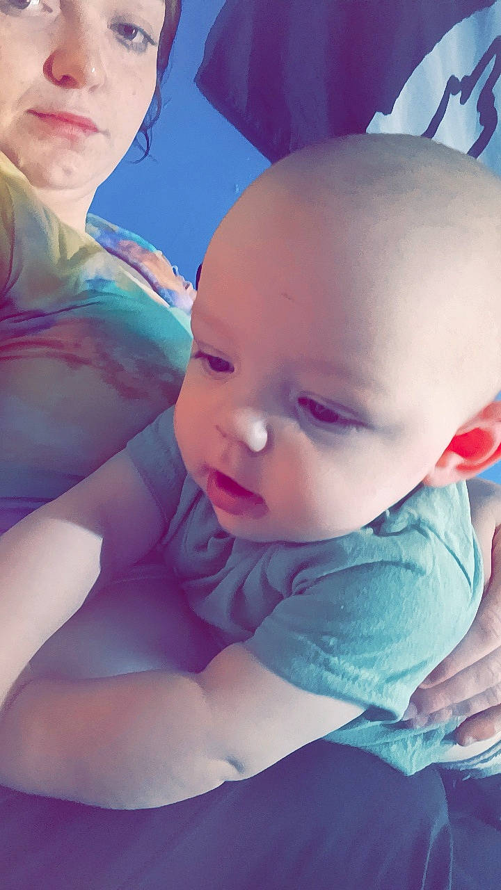 Kamryn is registered to the contest to win money with this photo: arm, azure, baby, baby_toddler_clothing, cheek, child, comfort, finger, fun, gesture, hand, happy, human_body, joint, lip, mouth, nose, person, pink, skin