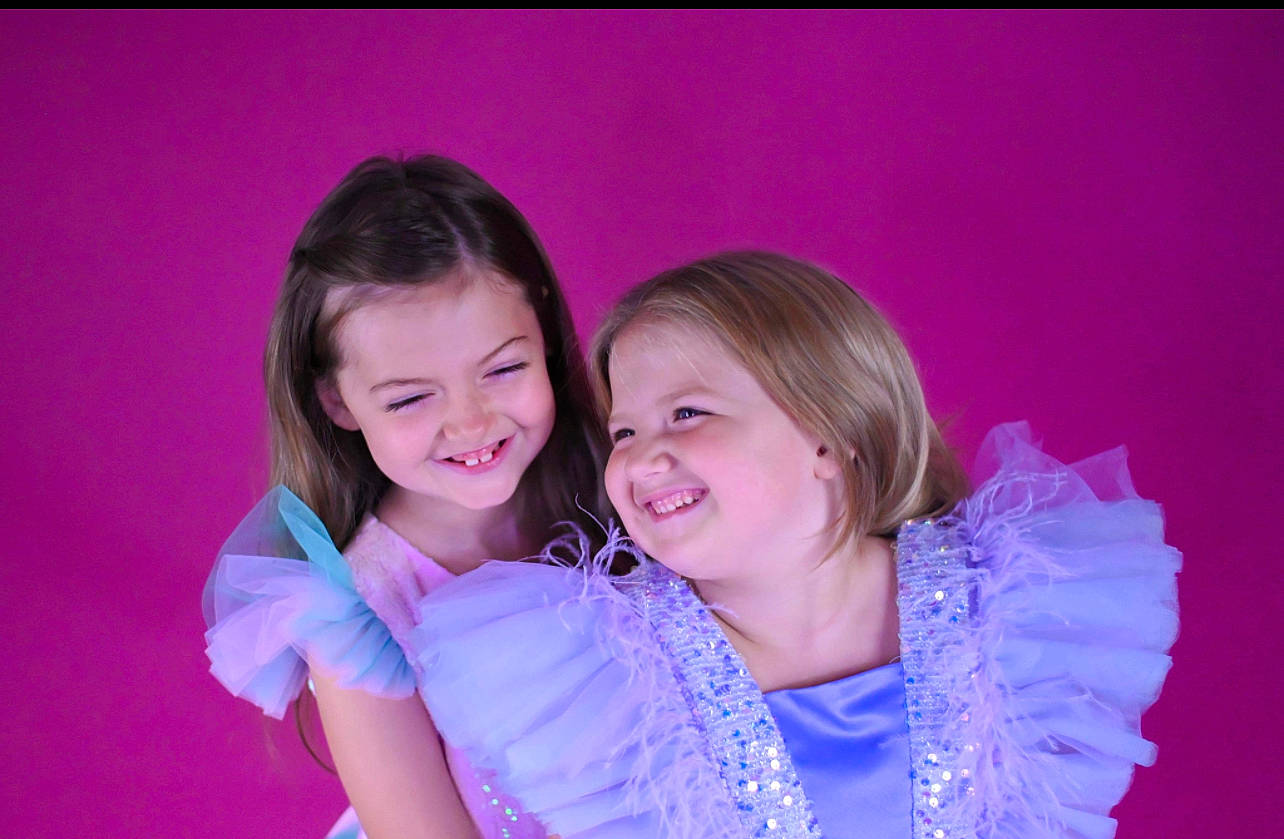 Mary is registered to the contest to win money with this photo: child, electric_blue, entertainment, event, face, flash_photography, formal_wear, fun, gesture, happy, jewellery, joy, laugh, magenta, person, pink, portrait_photography, purple, skin, smile