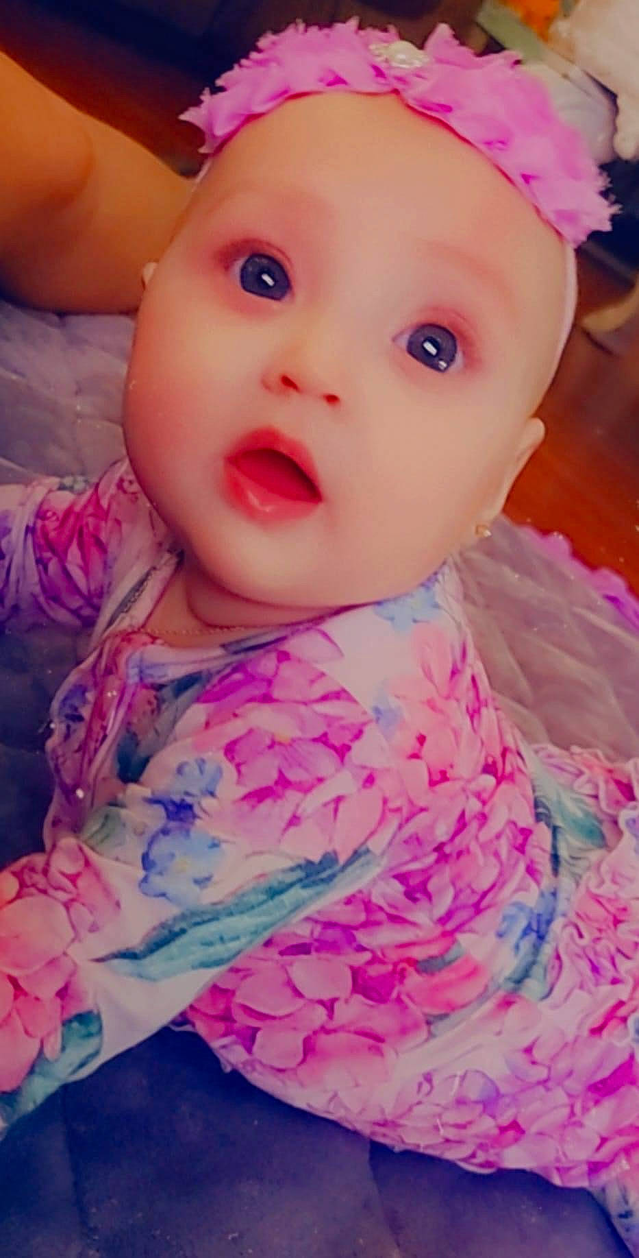 Mariska is registered to the contest to win money with this photo: baby, baby_toddler_clothing, cheek, chin, dress, eye, eyebrow, eyelash, face, happy, iris, lip, magenta, nose, person, pink, skin, sleeve, surprise, textile