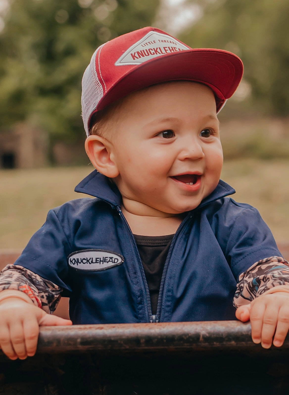 Callen joined the competition — help win amazing prizes! baseball_cap, cap, cheek, chin, eye, facial_expression, finger, flash_photography, grass, hand, happy, head, headwear, lip, outerwear, person, skin, sleeve, smile, toddler