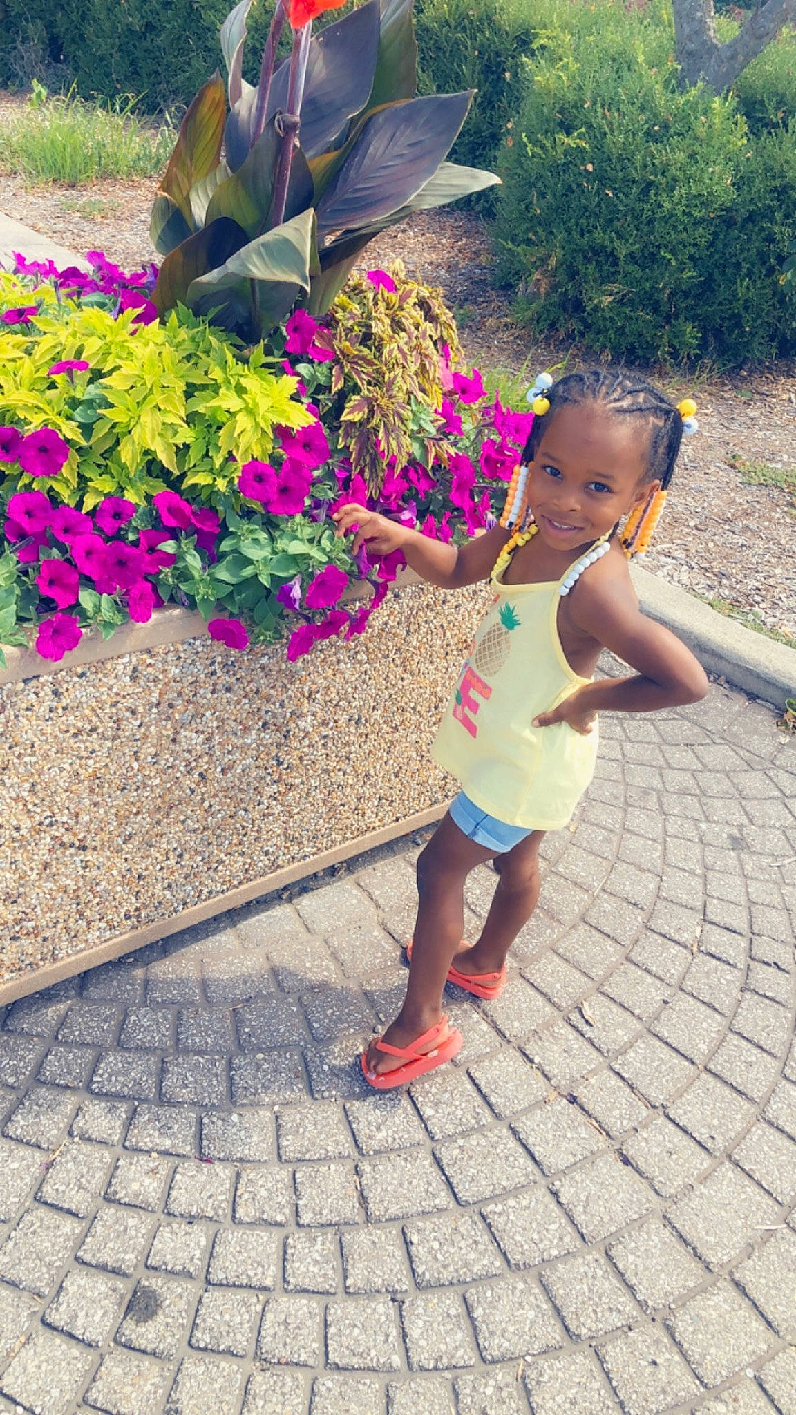 Chasity is registered to the contest to win money with this photo: adaptation, child, flower, footwear, fun, happy, joy, leaf, leg, leisure, magenta, people, person, pink, plant, play, shoe, sidewalk, summer, toddler