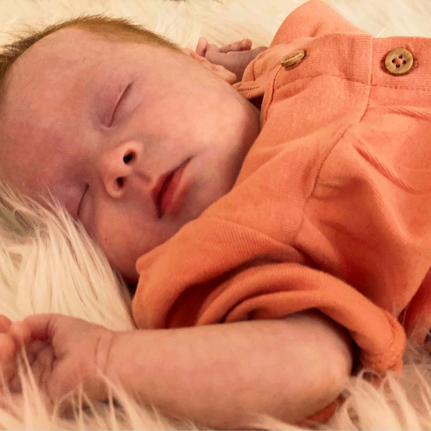 Annaleigh joined the competition — help win amazing prizes! baby, child, closeup, cozy, cute, face, fluffy, hand, infant, newborn, orange_clothing, peaceful, portrait, relaxation, resting, skin, sleeping, soft_texture, toddler, young