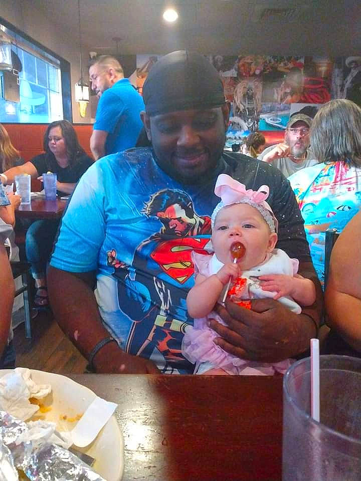 Meadow is registered to the contest to win money with this photo: baby, breakfast, chair, child, cuisine, event, face, fun, happy, hat, headwear, joy, leisure, party, person, plate, recreation, smile, t_shirt, table