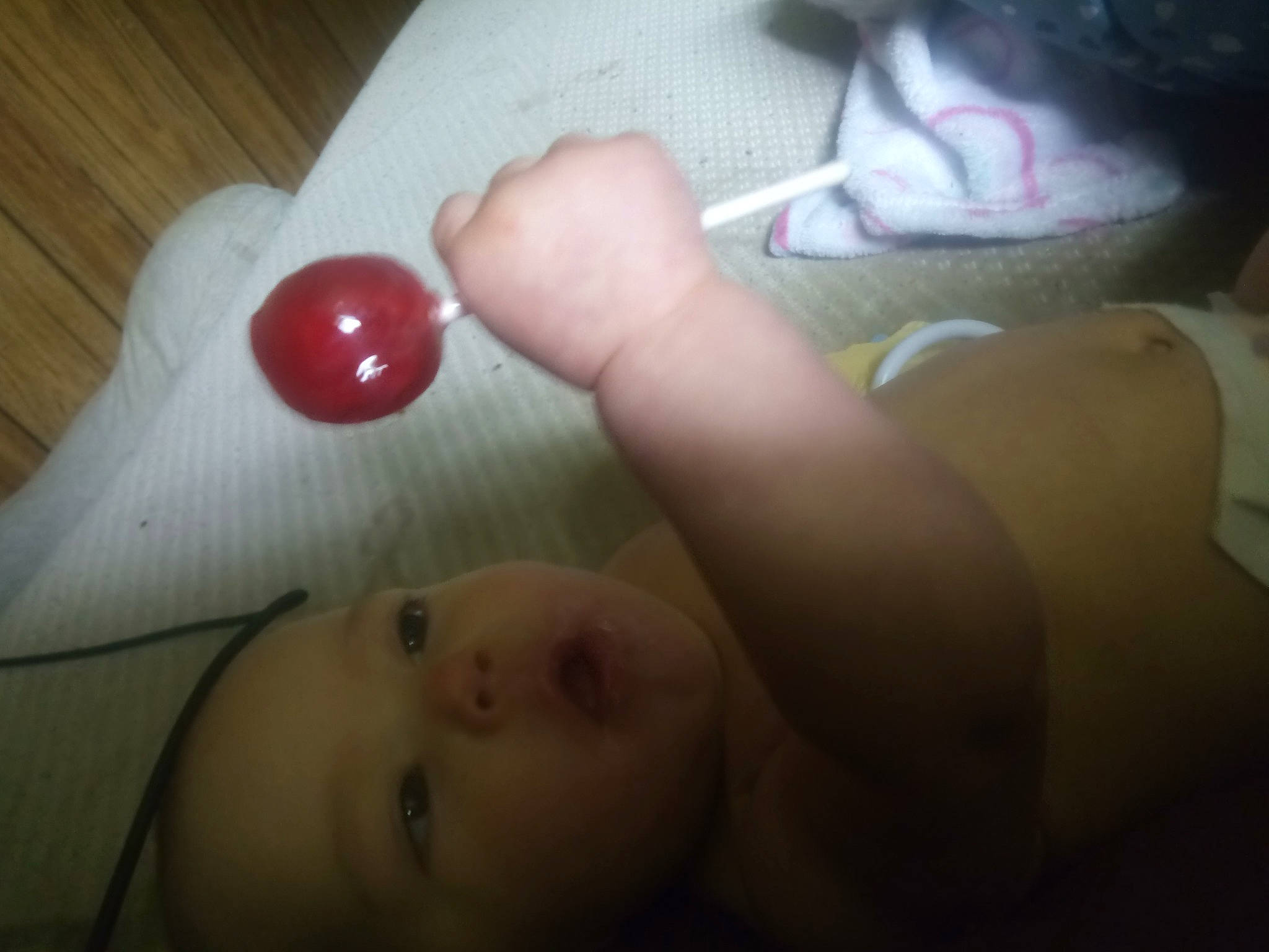 Meadow is registered to the contest to win money with this photo: baby, carmine, cherry, chest, comfort, finger, flesh, flooring, foot, fruit, human_body, human_leg, mouth, nail, natural_foods, person, skin, thumb, toddler, toy