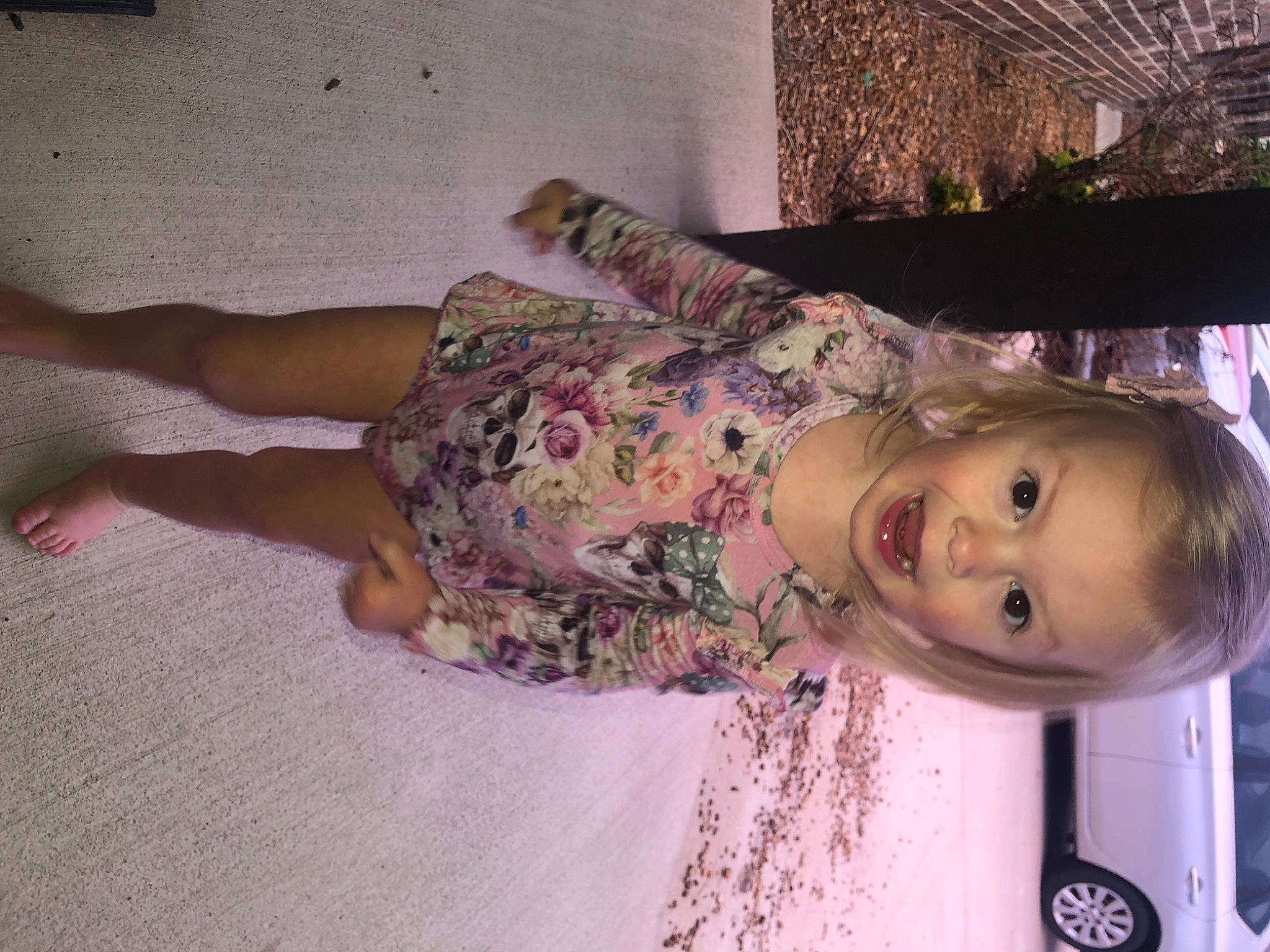 Lar-lee is registered to the contest to win money with this photo: car, child, flesh, flooring, fun, happy, human_leg, magenta, pattern, person, pink, purple, room, thigh, toddler