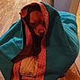 Aries is registered to the contest to win money with this photo: dog, blanket, cushion, indoor, wooden_floor, kitchen, small_dog, brown_dog, pet, cozy, wrapped, resting, furniture, home, animal, cute, quiet, relaxed, comfort, soft