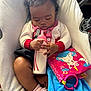 Dezire is registered to the contest to win money with this photo: baby, sleeping, bottle, curly_hair, blanket, soft_toy, unicorn, pink, blue, red, white, cozy, cushion, infant, cute, child, clothing, socks, indoor, peaceful