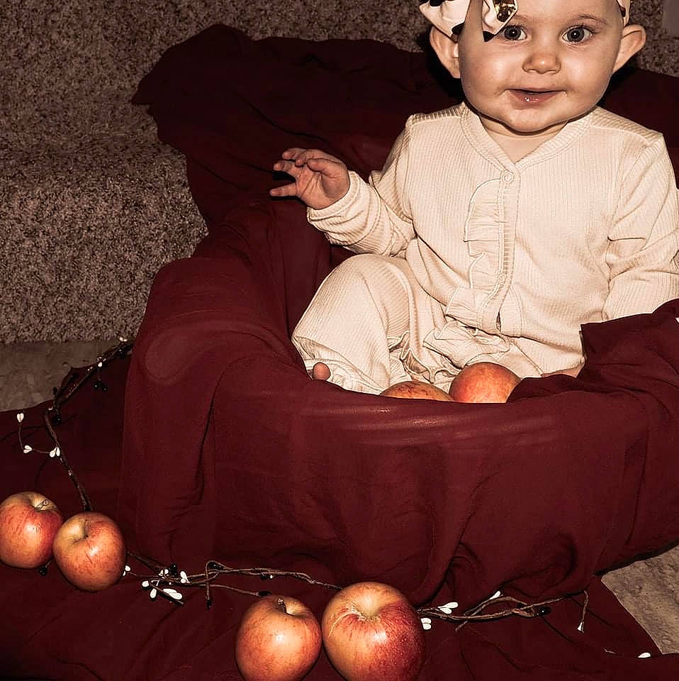 Kimber is registered to the contest to win money with this photo: baby, baby_toddler_clothing, beauty, black, comfort, darkness, event, flash_photography, fun, happy, headwear, joy, lap, natural_foods, person, photograph, sitting, sleeve, smile, snapshot
