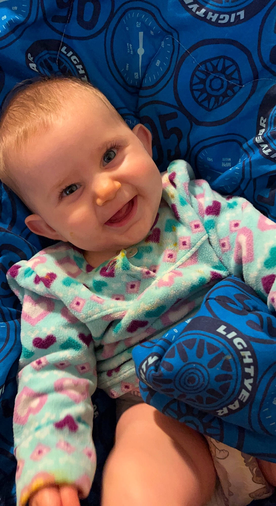 Kimber is registered to the contest to win money with this photo: azure, baby_toddler_clothing, blue, cheek, comfort, eye, facial_expression, happy, head, human_body, iris, joy, mouth, nose, organ, person, pink, product, skin, sleeve