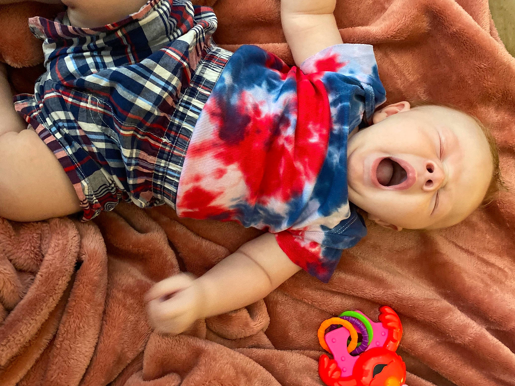 Kasen joined the competition — help win amazing prizes! baby, baby_toddler_clothing, child, doll, finger, gesture, joint, mouth, nail, orange, organ, person, plaid, product, red, skin, sleeve, tartan, textile, toy