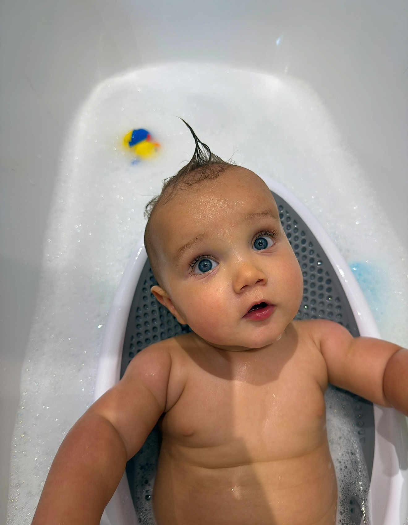 Smokey joined the competition — help win amazing prizes! baby, bathtub, bubble_bath, child, blue_eyes, moist_skin, rubber_duck, water, foam, cute, infant, skin, playful, hair_style, bath_time, sitting, looking_up, indoors, white_bathtub, expression