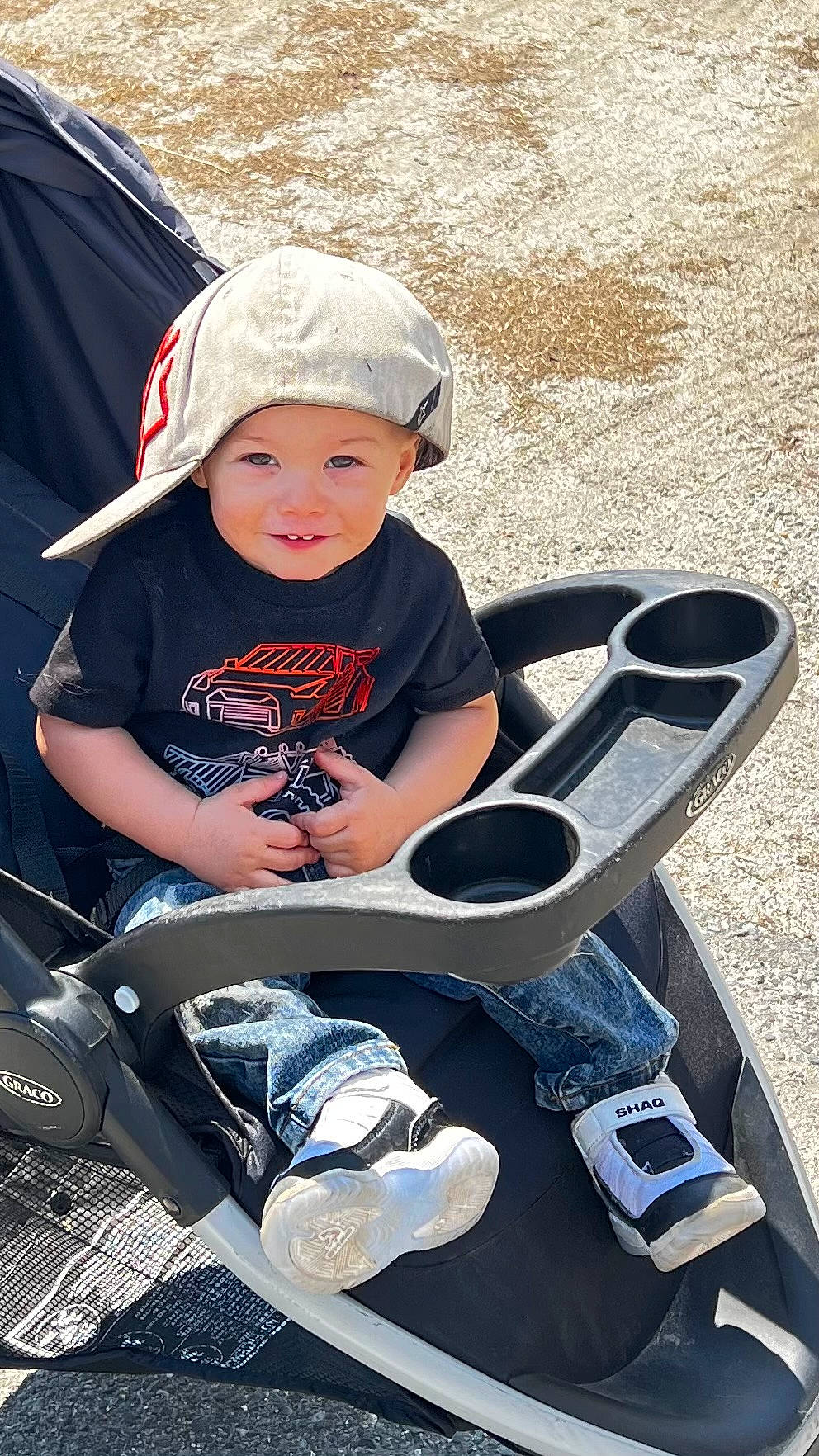 Ryder joined the competition — help win amazing prizes! auto_part, baby, baby_carriage, baby_products, baseball_cap, bumper, cap, child, cool, fashion_accessory, fun, grass, hat, headwear, joy, leisure, person, recreation, sitting, sneakers