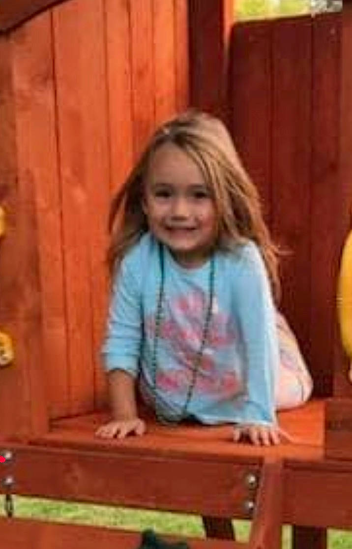 Briella is registered to the contest to win money with this photo: baby_toddler_clothing, blond, child, flooring, fun, hair, happy, hardwood, joy, leisure, magenta, pattern, person, play, sitting, smile, t_shirt, table, toddler, varnish