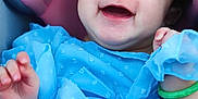 Katia is registered to the contest to win money with this photo: baby, smiling, blue_dress, infant, happy, child, portrait, cute, pink_cushion, face, hand, jewelry, bracelet, closeup, young_child, indoors, cheerful, baby_girl, soft_lighting, curly_hair
