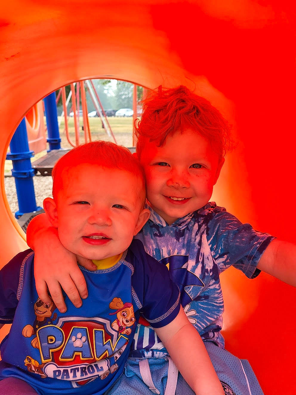 Sage is registered to the contest to win money with this photo: baby, baby_toddler_clothing, cool, fun, hairstyle, happy, human_body, iris, joy, leisure, mouth, nose, orange, person, pink, plant, red, skin, smile, standing