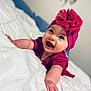 Athena joined the competition — help win amazing prizes! adorable, baby, bed, blanket, close_up, clothing, eyes, hands, headband, infant, joyful, lying_down, magenta, pink_hat, portrait, room_interior, rosy_cheeks, skin, smiling, white_bedding