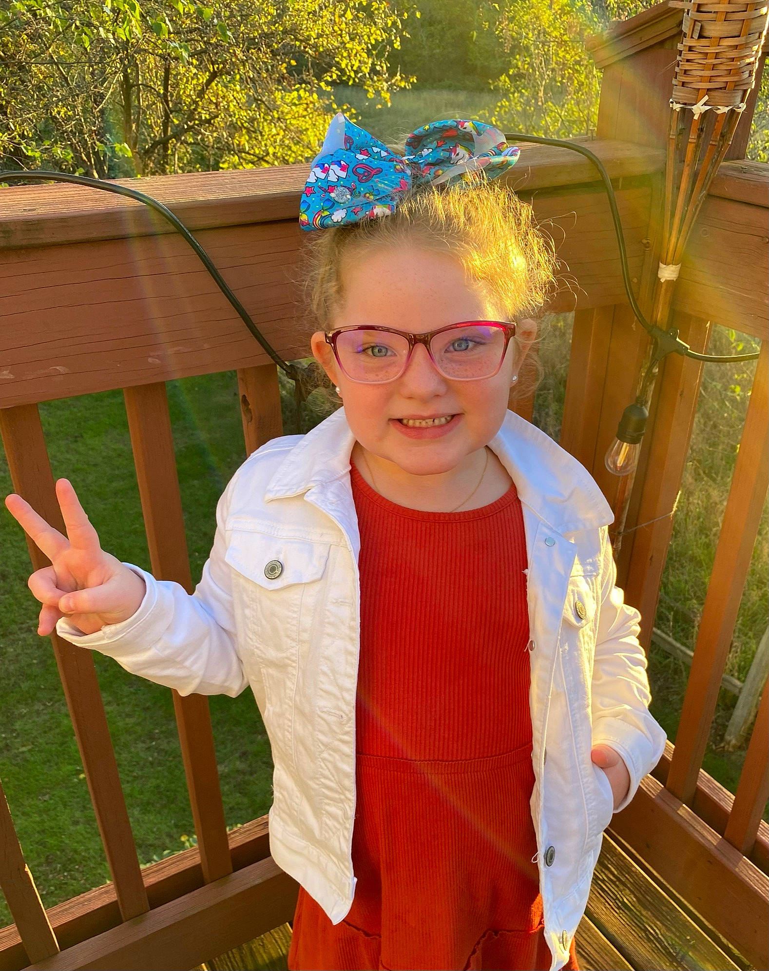 Eliyanah is registered to the contest to win money with this photo: event, eyewear, fashion_accessory, fun, glasses, grass, happy, headpiece, jewellery, joy, leisure, organ, people_in_nature, person, personal_protective_equipment, plant, smile, standing, tree, vision_care