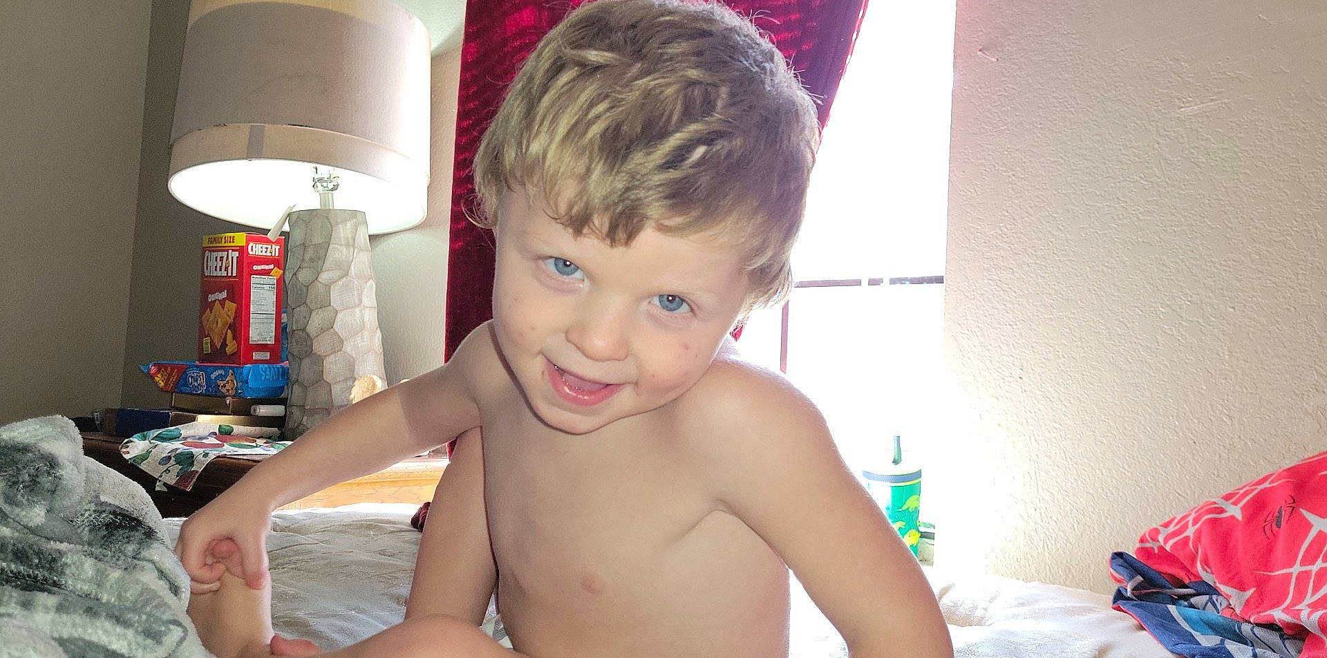 Mason is registered to the contest to win money with this photo: barechested, bathing, cheek, chest, child, fun, happy, home_accessories, joy, leisure, person, play, room, sitting, smile, thumb, toddler, vacation