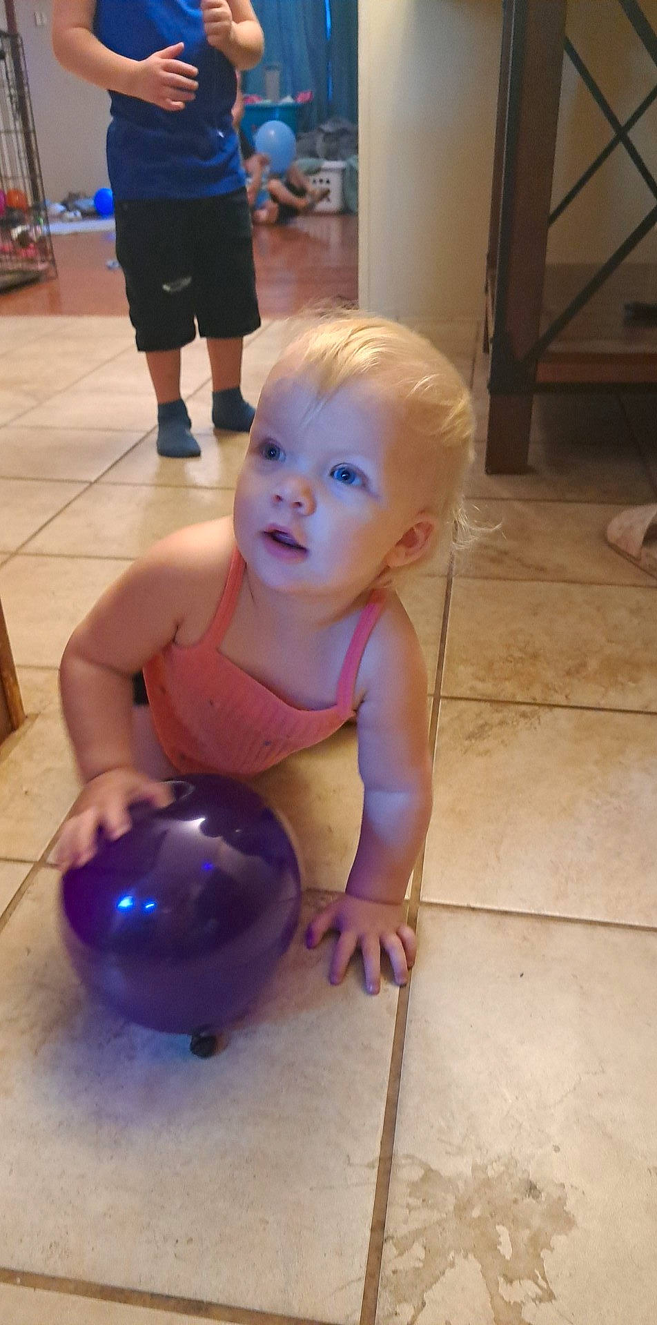 Paisley joined the competition — help win amazing prizes! arm, chest, child, face, facial_expression, finger, floor, flooring, foot, fun, human_body, human_leg, joint, leg, person, shorts, sitting, thigh, toddler, trunk
