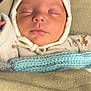 Yvana a rejoint le concours — aidez-le/la à gagner de superbes lots ! baby, newborn, sleeping, infant, hat, beanie, blanket, knit_blanket, cozy, swaddle, closeup, portrait, face, eyes_closed, peaceful, soft_texture, indoors, clothing, crib_or_bedding, cheeks