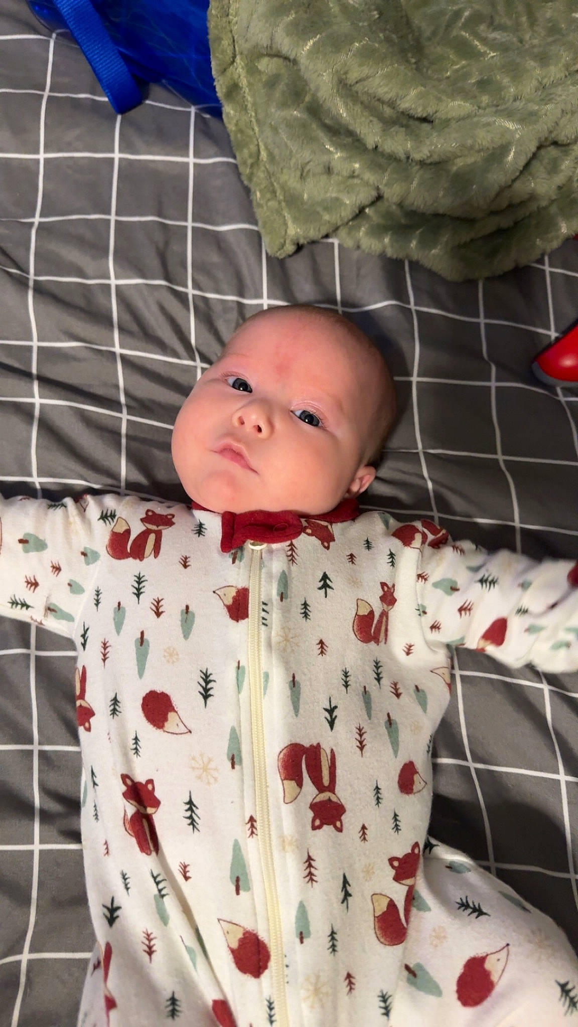 Benny is registered to the contest to win money with this photo: baby, baby_products, baby_toddler_clothing, baby_toys, bedding, carmine, child, comfort, head, linens, pattern, person, plaid, room, sleeve, textile, toddler, toy