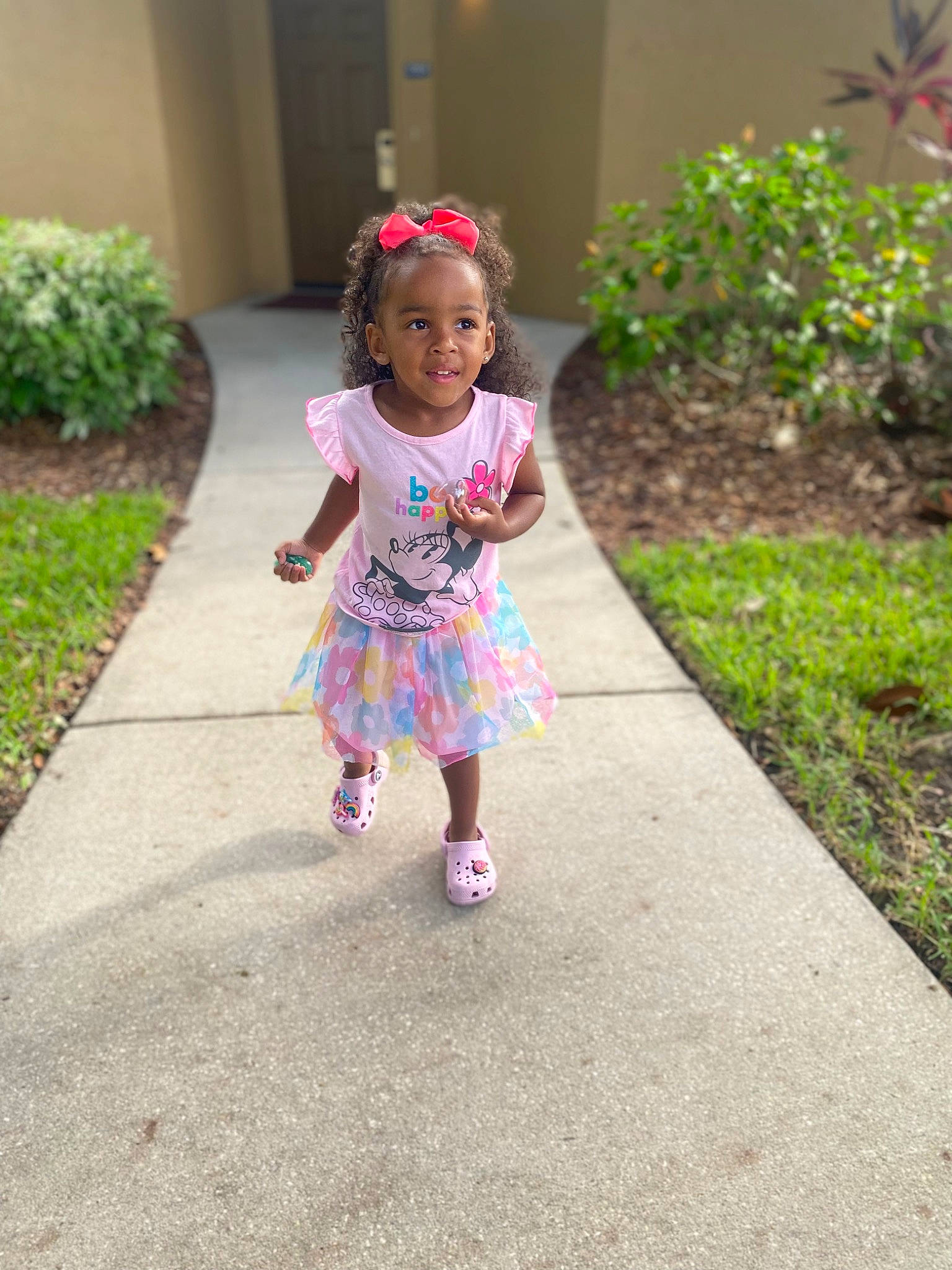 Ariah is registered to the contest to win money with this photo: asphalt, baby_toddler_clothing, child, dress, event, grass, happy, joy, leaf, leisure, magenta, pattern, people_in_nature, person, pink, plant, recreation, road, road_surface, spring