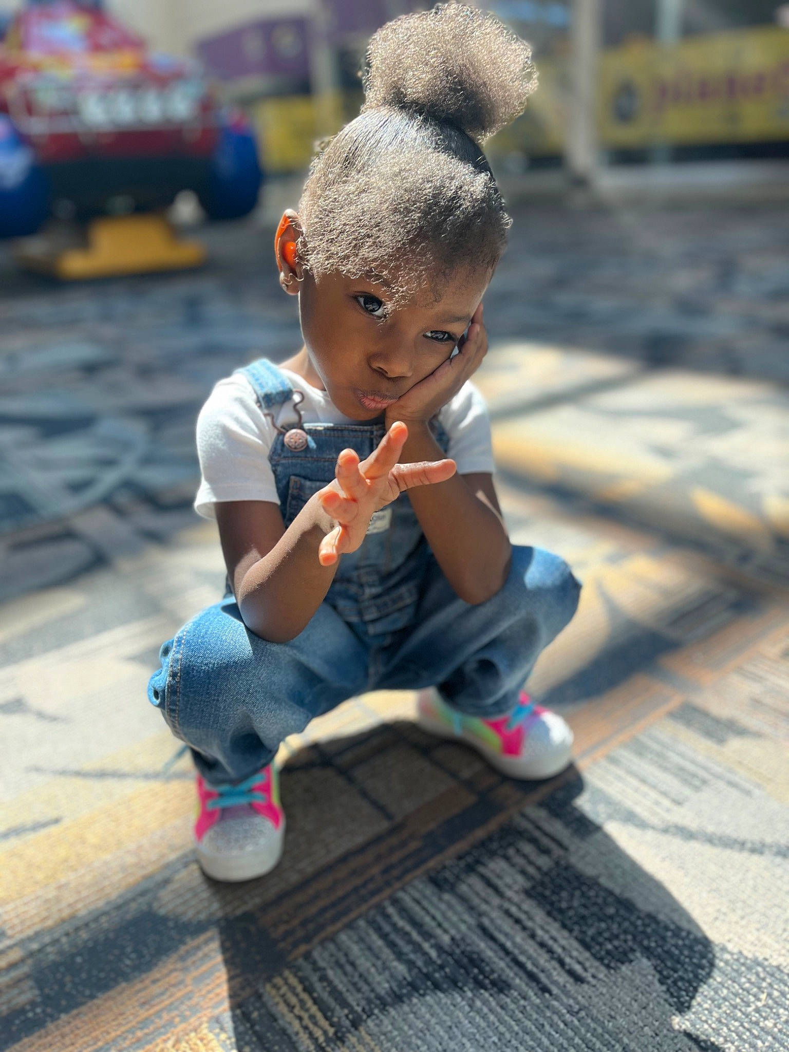 Nylah joined the competition — help win amazing prizes! asphalt, child, city, flooring, fun, leisure, pedestrian, person, play, public_space, recreation, road, road_surface, sidewalk, sitting, street, tire, toddler, tourism, vacation