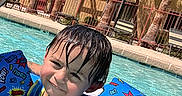 Julian joined the competition — help win amazing prizes! child, pool, water, floaties, swimming_ring, wet_hair, sunny_day, outdoor, palm_trees, blue_sky, toy_story, smiling, summer, recreation, leisure, swimwear, playful, fun, vacation, young