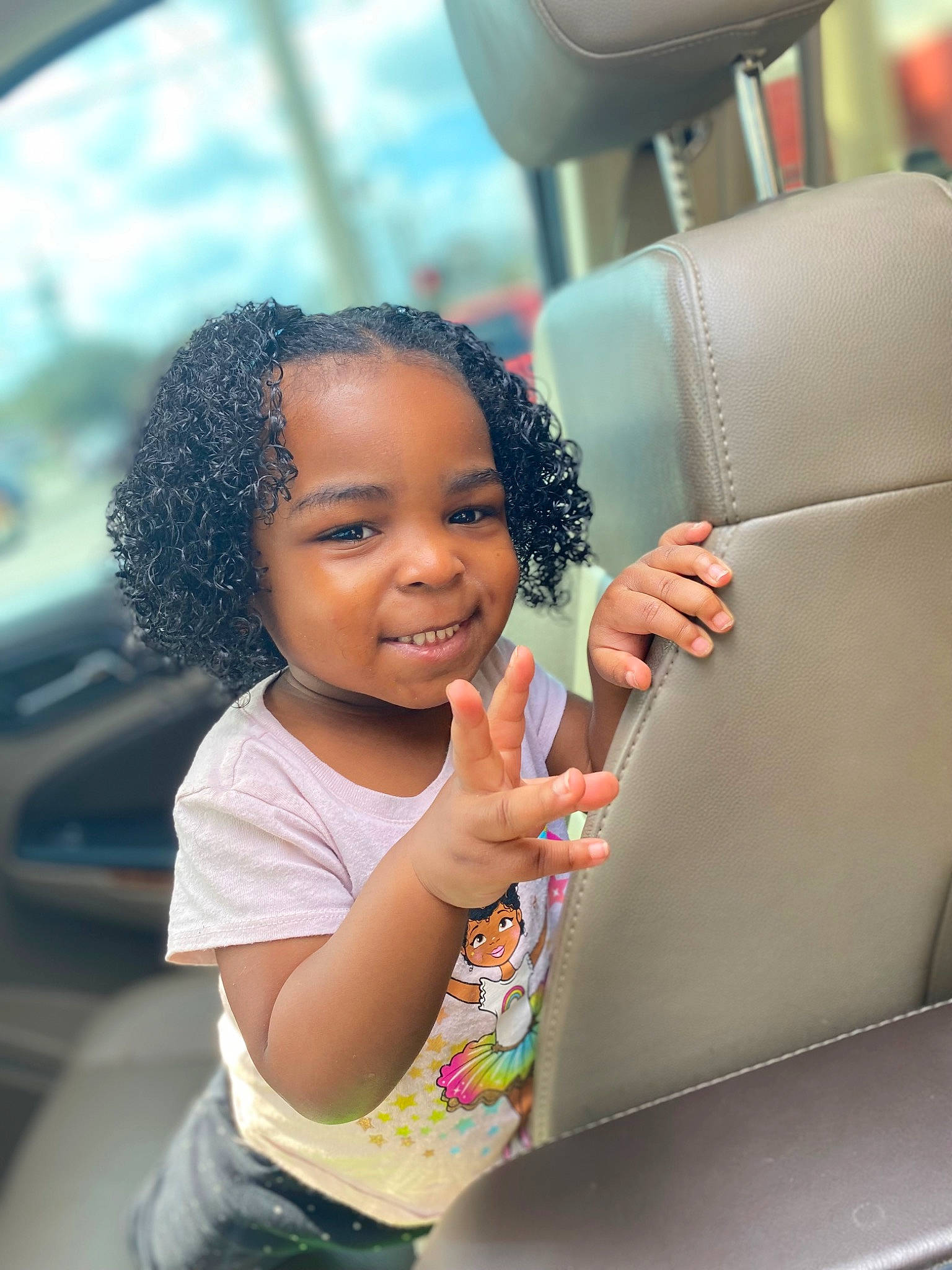 Stori is registered to the contest to win money with this photo: auto_part, automotive_design, beauty, black_hair, child, flash_photography, fun, hairstyle, happy, joy, leisure, mode_of_transport, motor_vehicle, people, person, photograph, skin, smile, summer, toddler