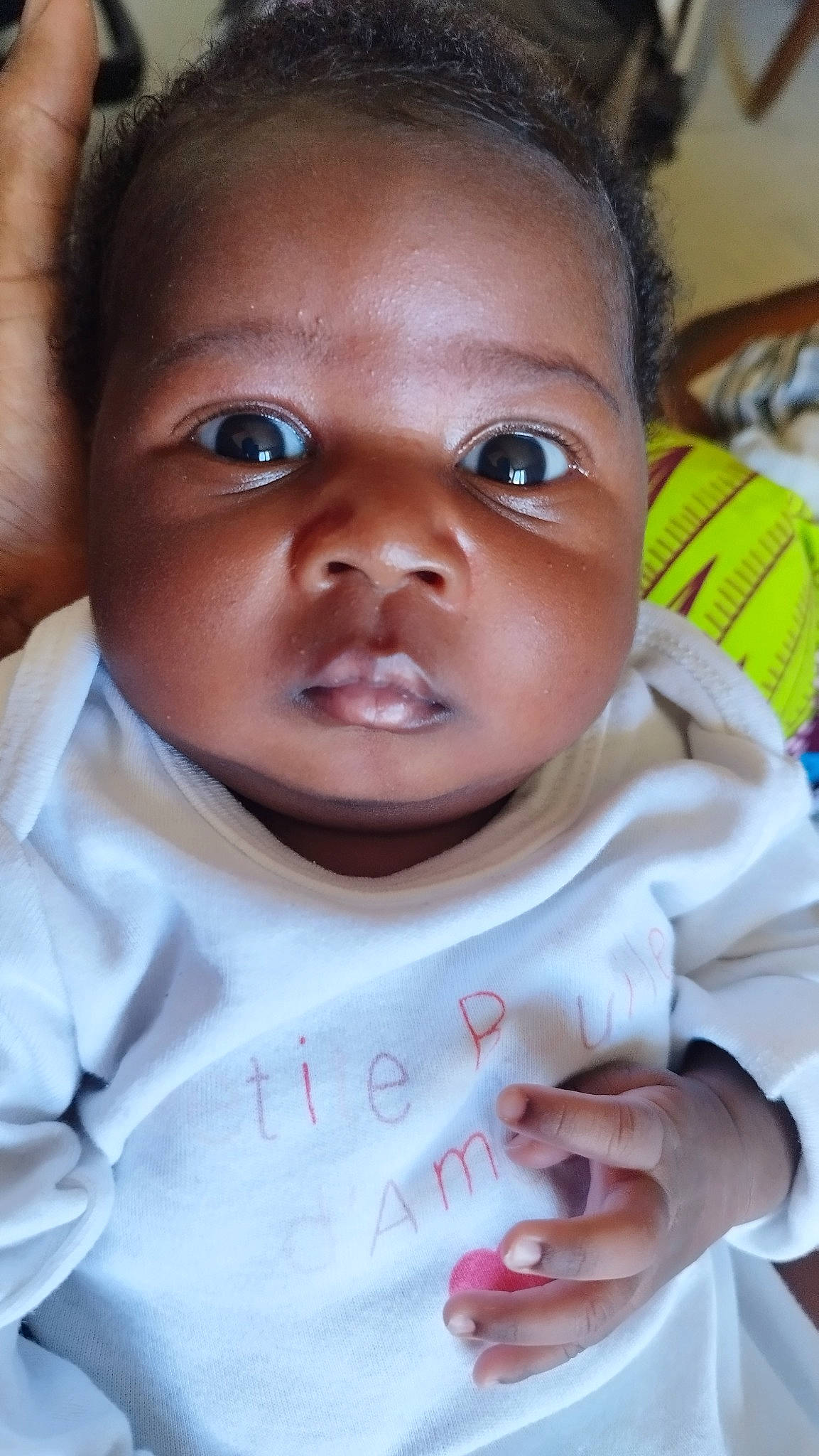 Lyana participe au concours pour gagner de l'argent avec cette photo : baby, cheek, chin, ear, eyebrow, eyelash, facial_expression, forehead, gesture, happy, iris, lip, mouth, nose, person, skin, sleeve, smile, toddler, tooth