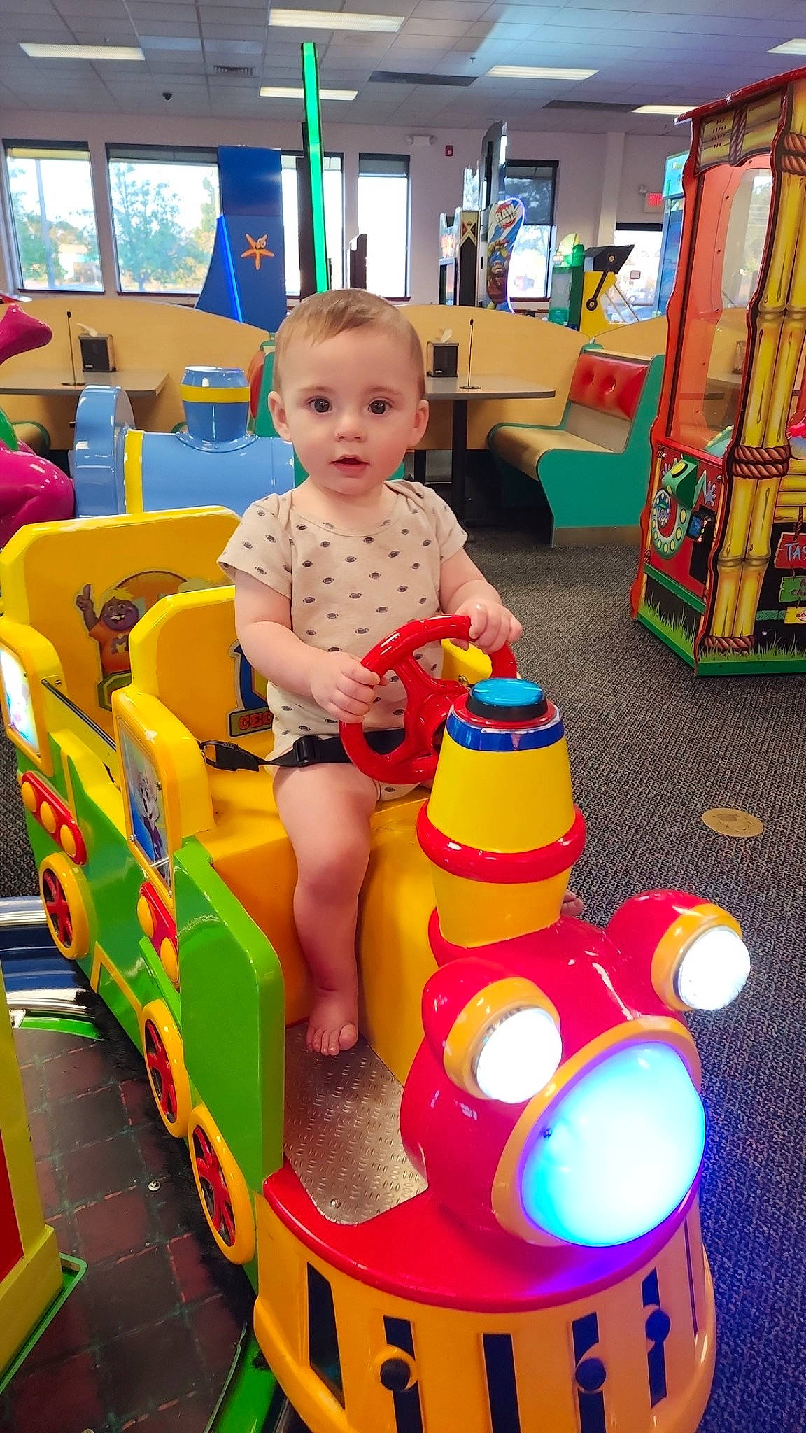 Brantley is registered to the contest to win money with this photo: baby, baby_products, baby_toddler_clothing, child, event, fun, leisure, person, plastic, play, playground, product, recreation, riding_toy, shorts, smile, snapshot, toddler, toy, wheel