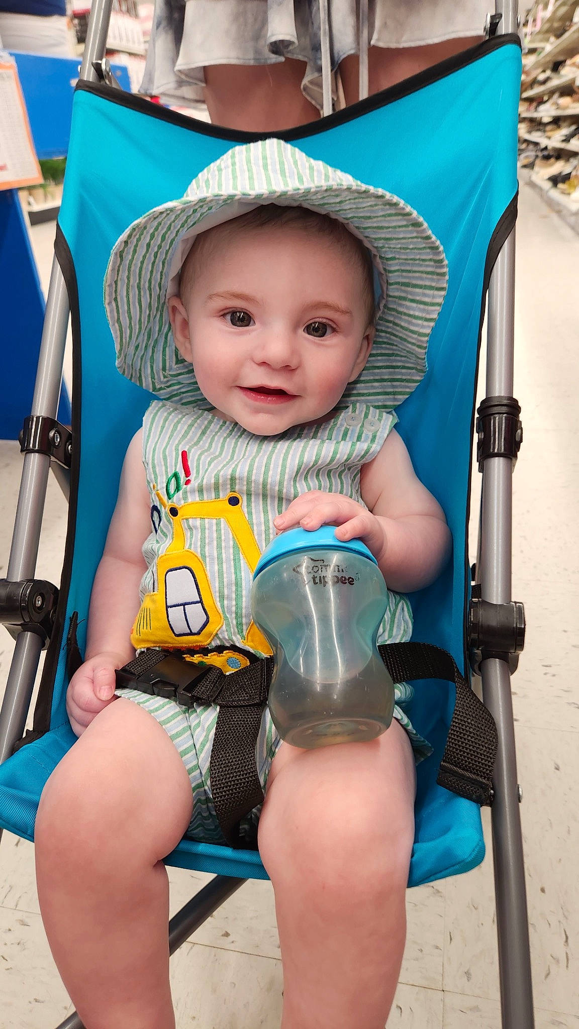 Brantley is registered to the contest to win money with this photo: baby, baby_carriage, baby_products, baby_toddler_clothing, beauty, blue, cheek, child, comfort, electric_blue, human_leg, joy, knee, leg, person, plastic_bottle, sitting, skin, smile, thigh
