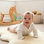 Hope is registered to the contest to win money with this photo: baby, basket, carpet, child, cute, floor, happy, indoors, infant, natural_light, nursery, playroom, rocking_horse, rug, smiling, soft_texture, teddy_bear, toy, white_clothing, window