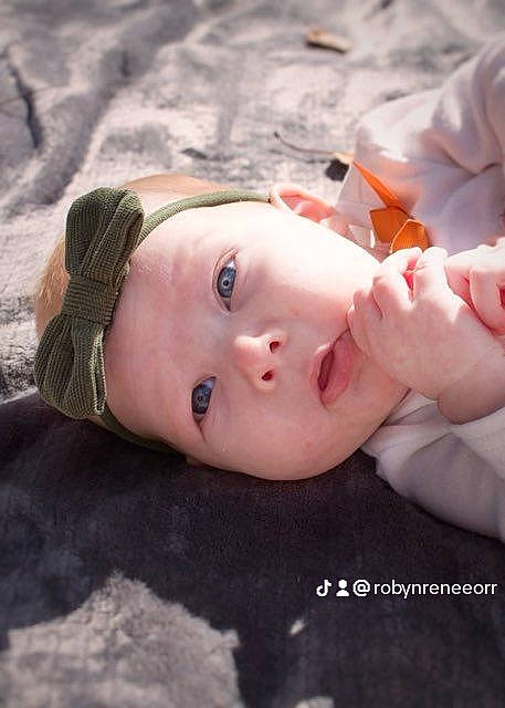 Riya is registered to the contest to win money with this photo: baby, baby_toddler_clothing, cheek, chest, child, eye, eyebrow, eyelash, flesh, fun, gesture, grass, happy, headwear, lip, neck, nose, pattern, person, portrait_photography